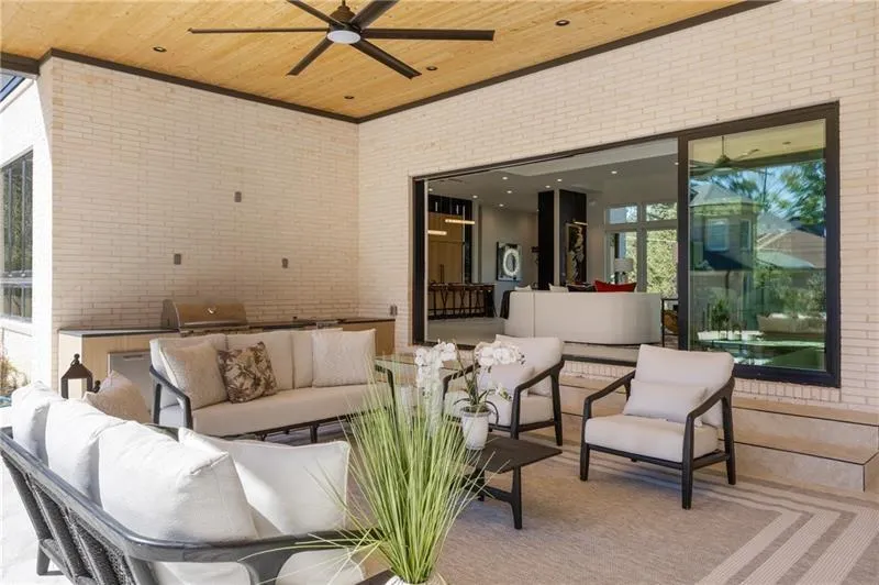 View of patio / terrace featuring outdoor lounge area, ceiling fan, and area for grilling