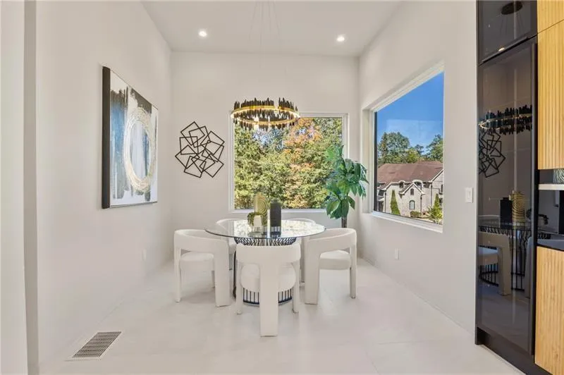 Dining area featuring a chandelier and recessed lighting