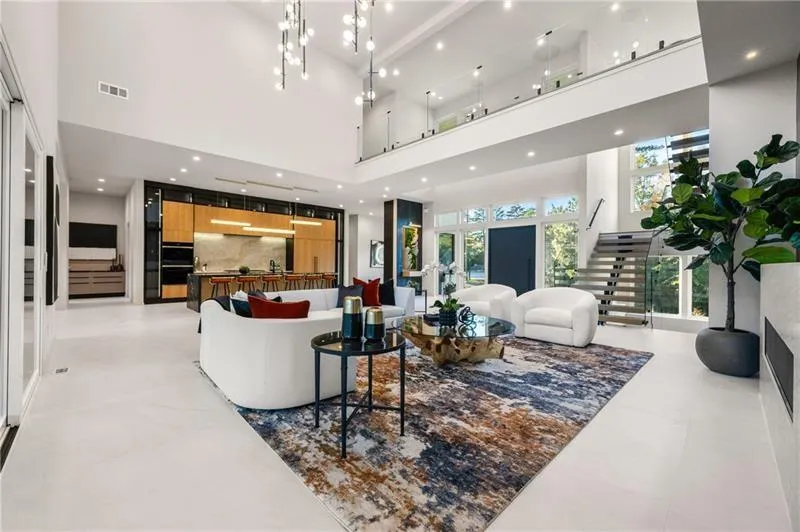 Living room with recessed lighting and a high ceiling