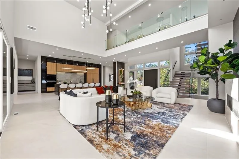 Living room featuring a towering ceiling and recessed lighting