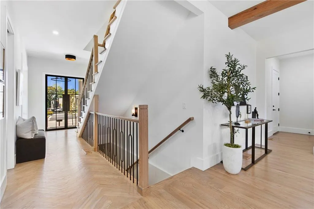 Stairs with beamed ceiling and parquet flooring