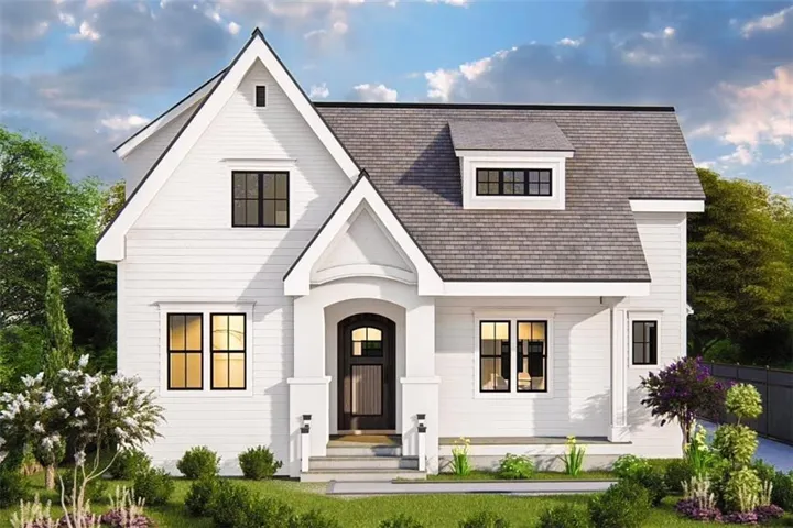 White siding exterior featuring a grey shingle roof, black-framed windows, an arched entry, and a dormer window