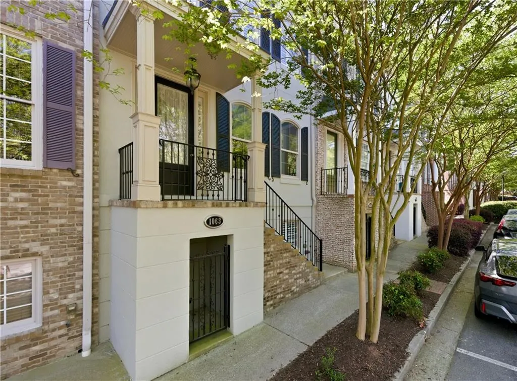 Doorway to property featuring brick siding
