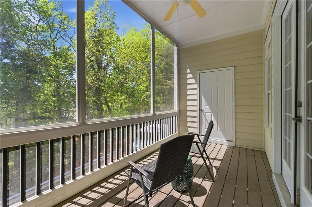 Sunroom / solarium with ceiling fan and plenty of natural light