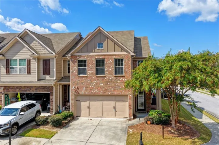 Brick and siding exterior with a two-car garage
