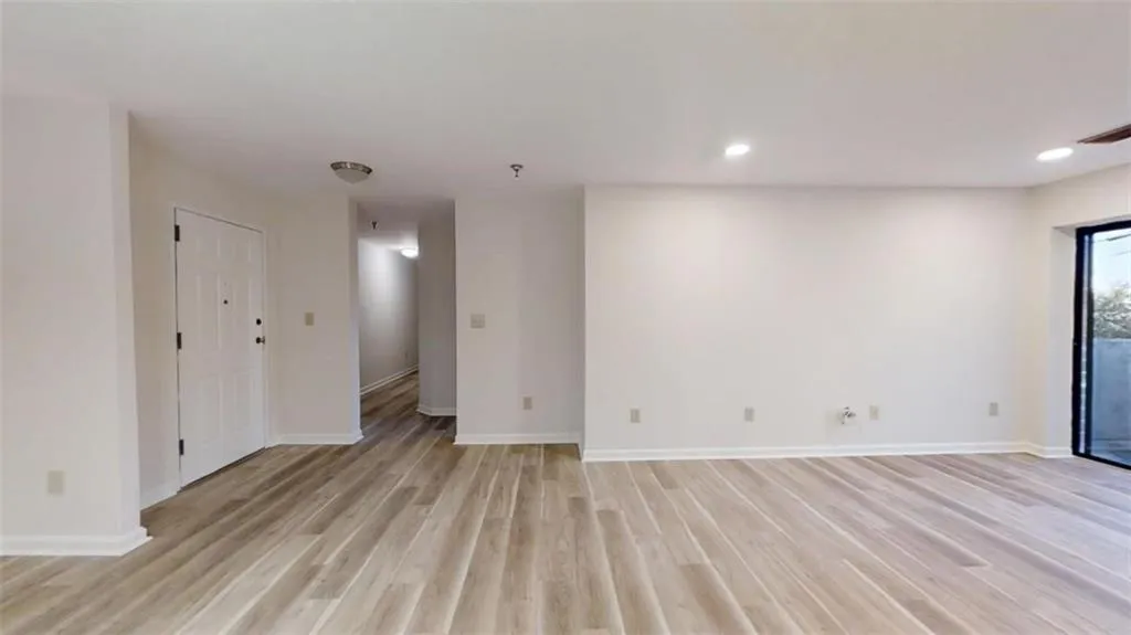 Spare room featuring recessed lighting, visible vents, light wood-style flooring, and baseboards