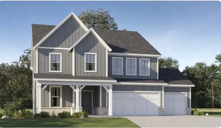 Two-story exterior with board and batten siding, gable rooflines, covered front porch, and a three-car garage
