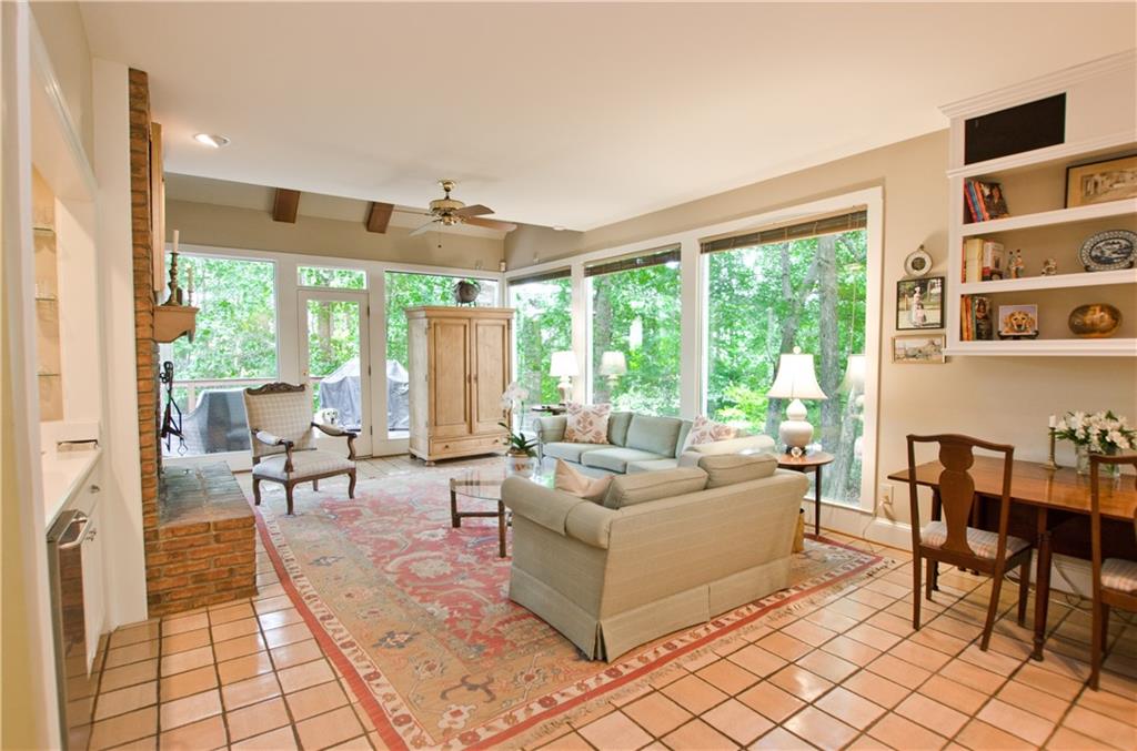 The den features a wet bar/ built-in bookcases and fireplace