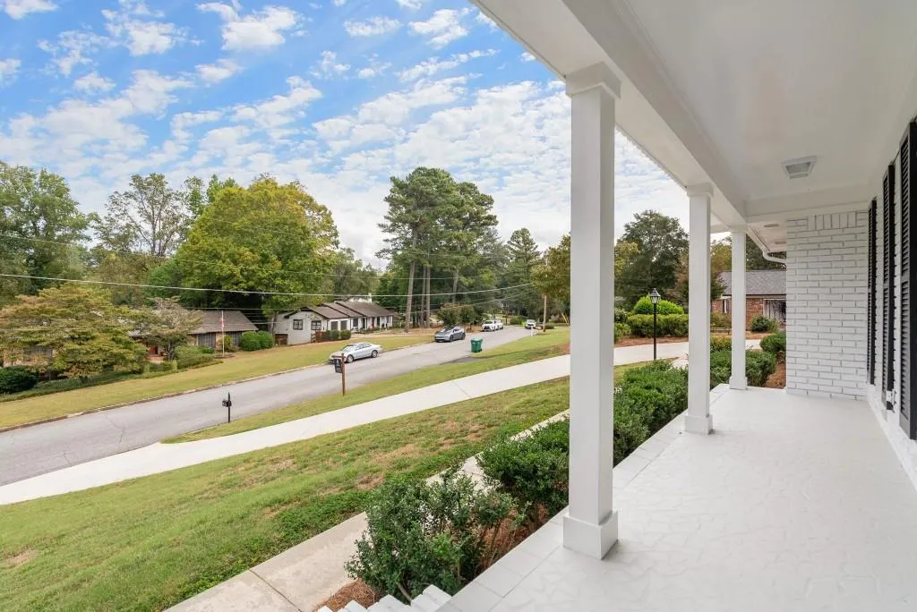 Rocking Chair Front Porch Sits Perched Above To Soak In This Fantastic Neighborhood!