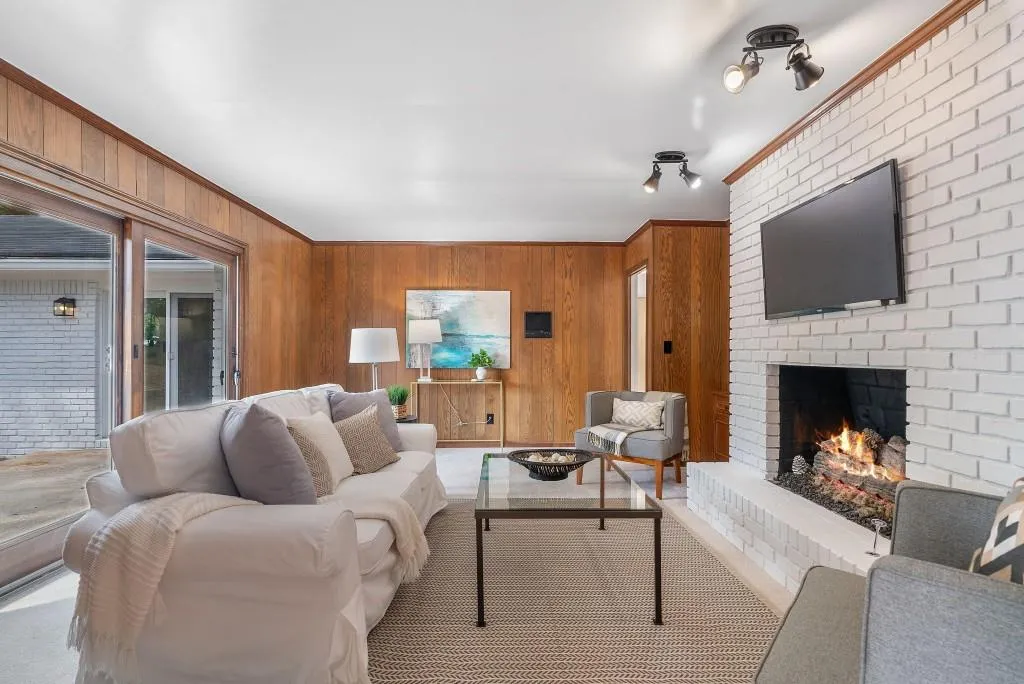 Fireside Family Room With Sliding Door Brings In Natural Light!
