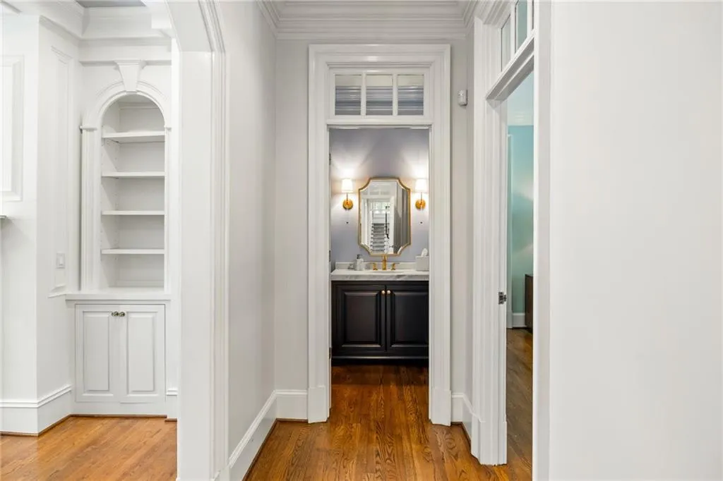 Built-in arched shelving with lower cabinet storage