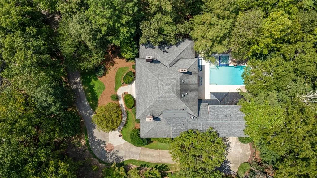 Asphalt shingle roofing with multiple chimneys