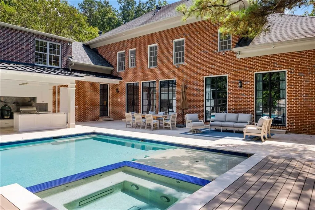 Brick exterior with multiple multi-pane windows and doors