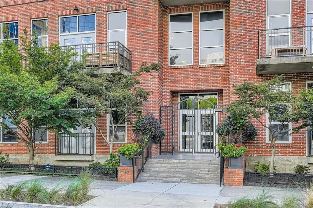 Entrance to property featuring brick siding