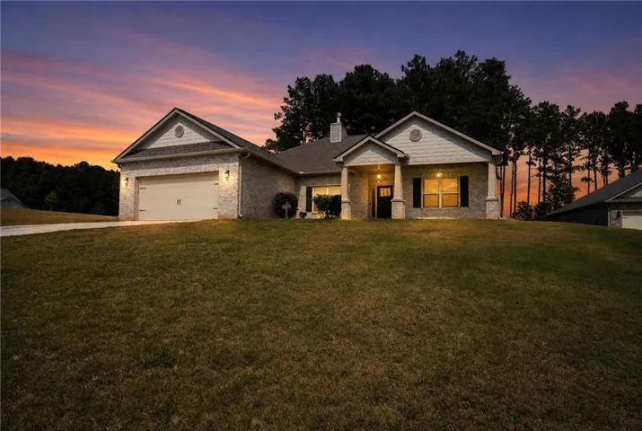 Brick veneer exterior with gabled roof lines and an attached garage