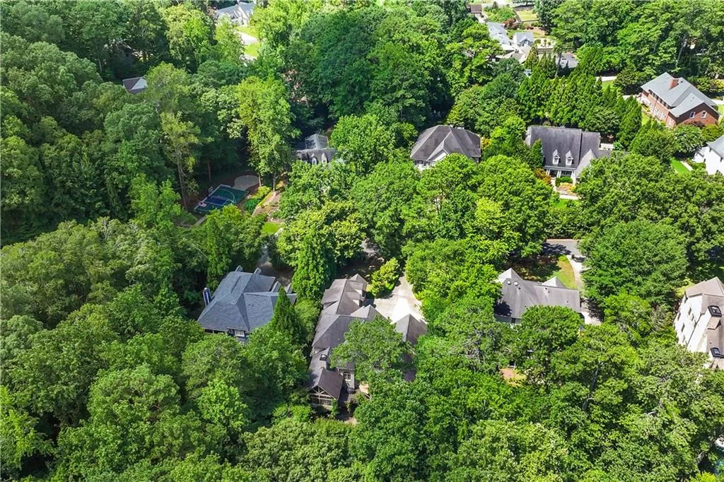 Aerial view of property's location featuring nearby suburban area