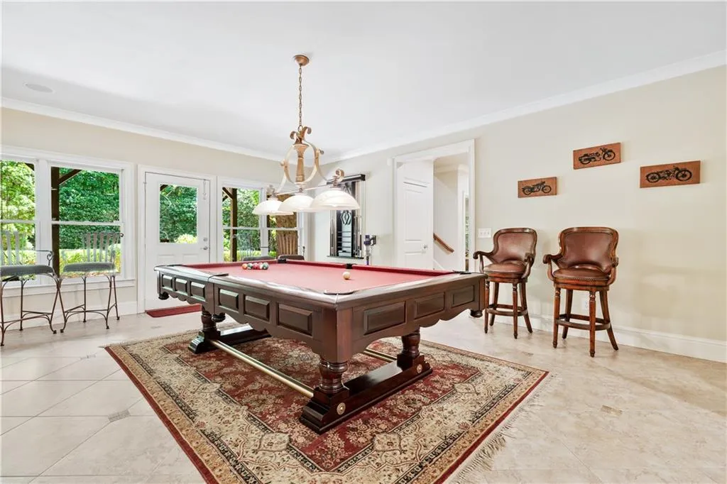Recreation room featuring crown molding and billiards table