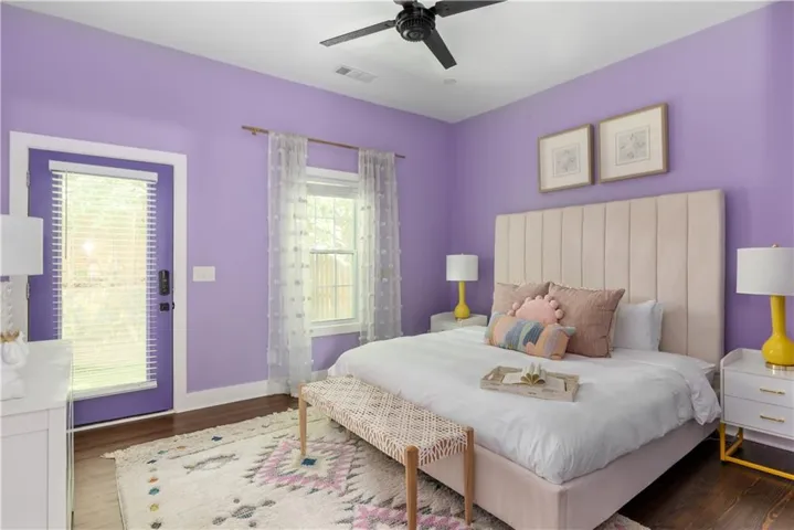 Bedroom with dark wood finished floors and ceiling fan