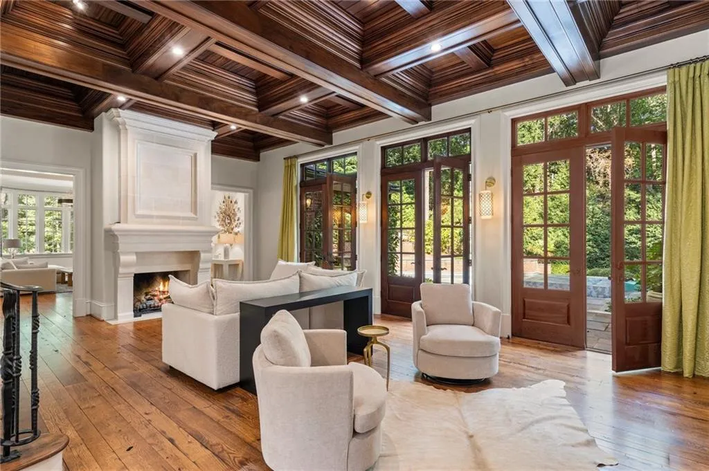 Reclaimed wide plank flooring, solid doors, open to family room and kitchen. Walk out to pool and outdoor kitchen and covered seating.