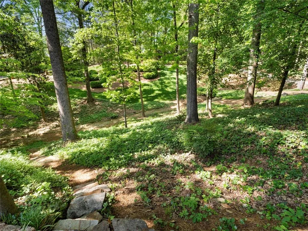 Walking trails. Second driveway for overflow parking and yard access. Separate well for watering.