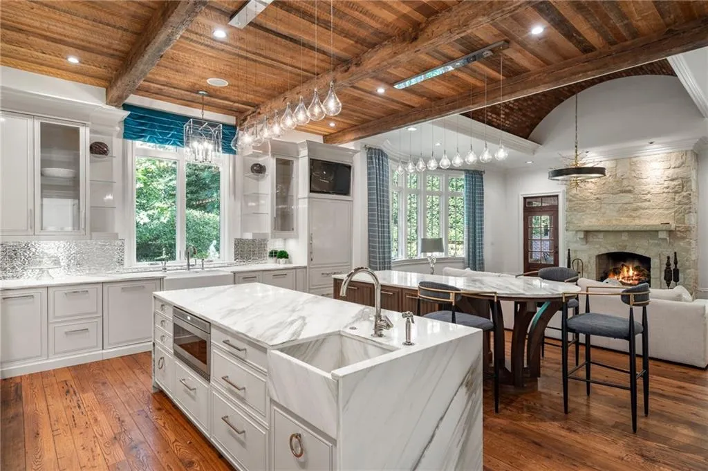 Double islands, double appliances, marble countertops.