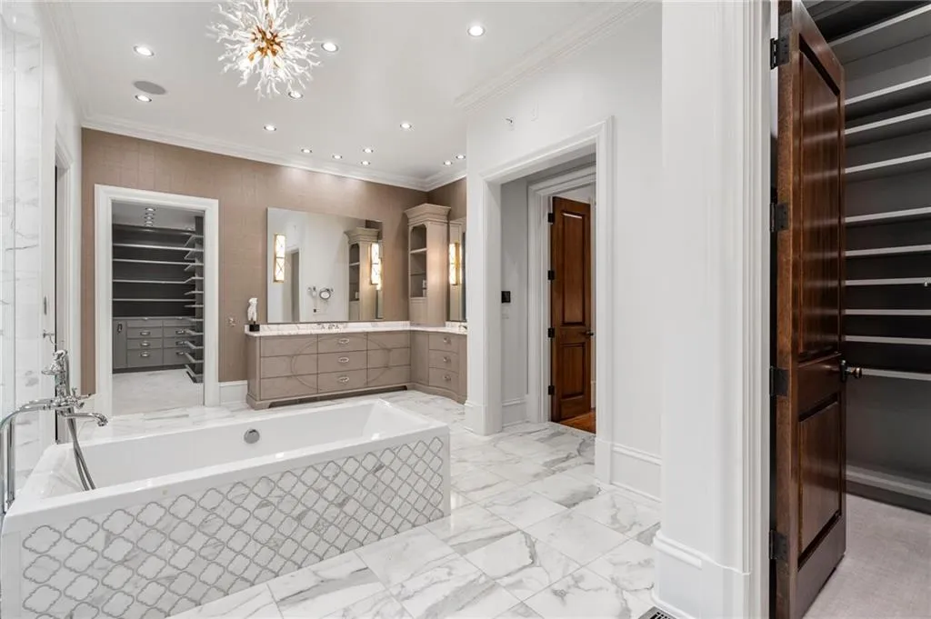 Separate vanities, dressing rooms and water closets.