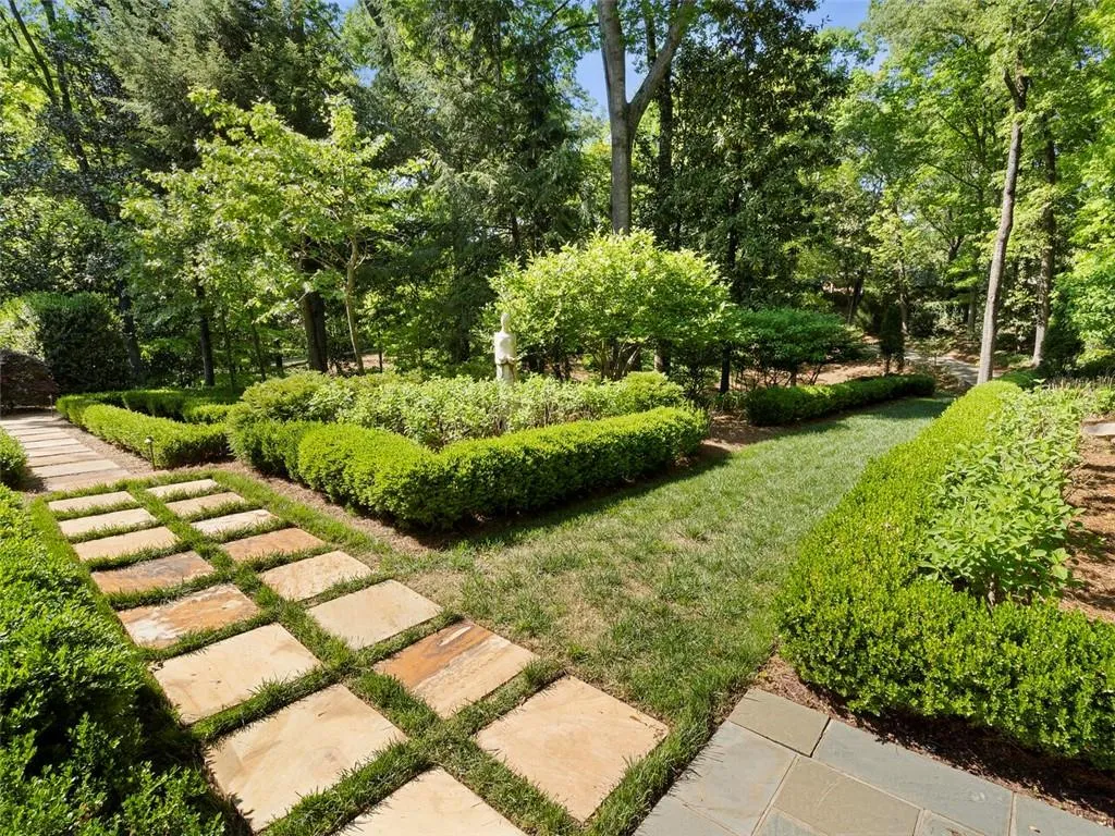 Additional landscaped grounds to the left of the house. Very rare to find this much land in 30327.