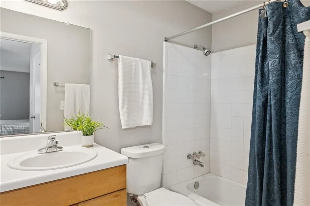 Bathroom featuring vanity and shower / tub combo