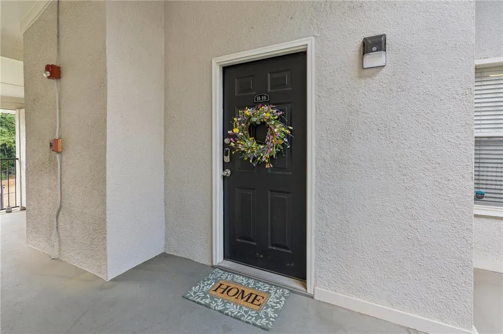 View of exterior entry with stucco siding