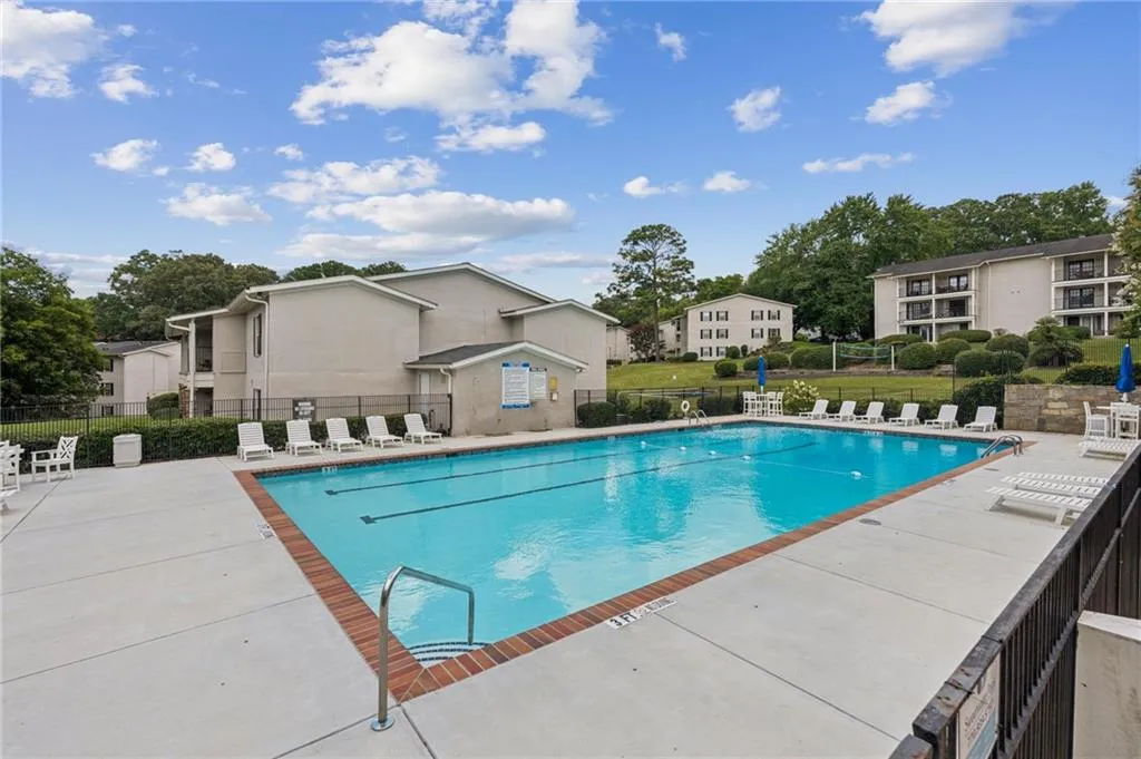 Community pool with a patio