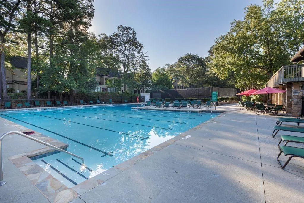 Community pool featuring a patio area Community pool featuring a patio area
