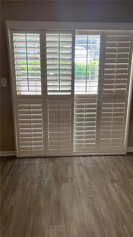 Detailed view of wood finished floors and baseboards
