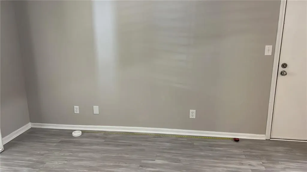 Unfurnished room featuring wood finished floors