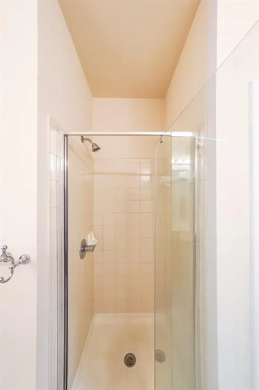 Full bathroom with a shower stall