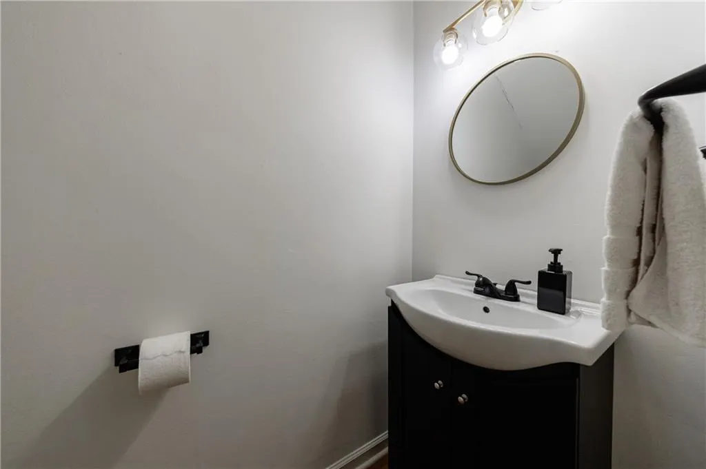 Bathroom with vanity and baseboards