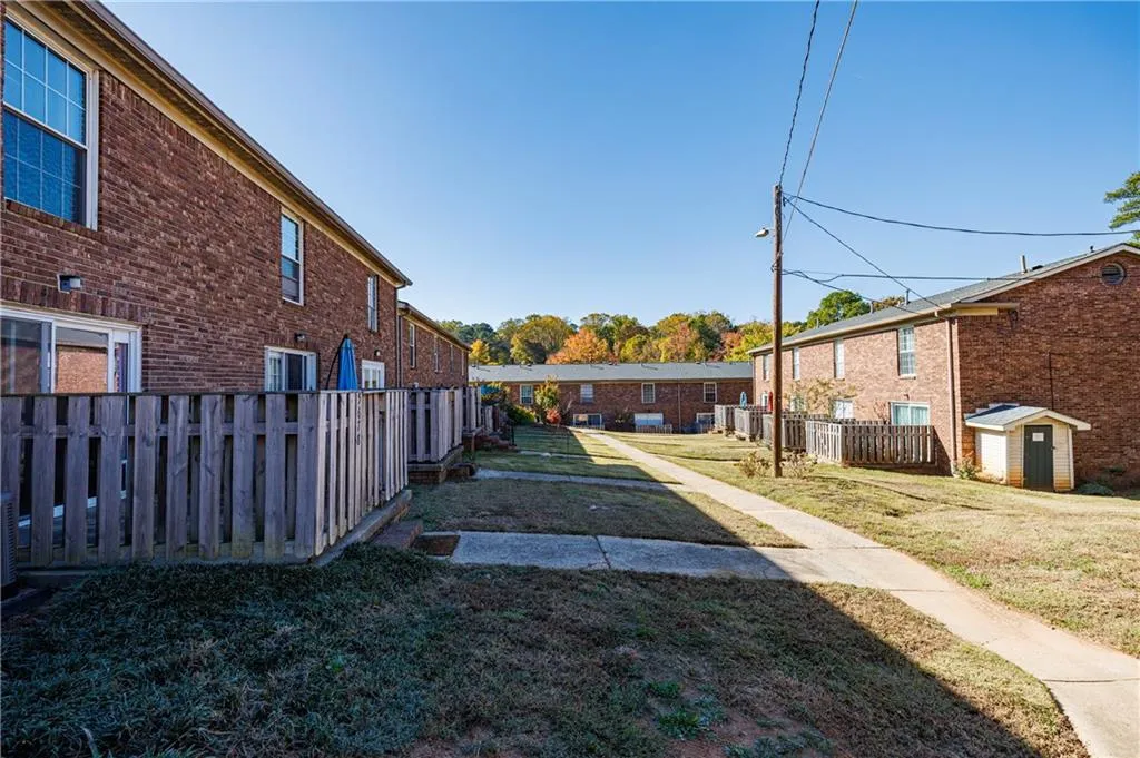 View of yard with a storage unit