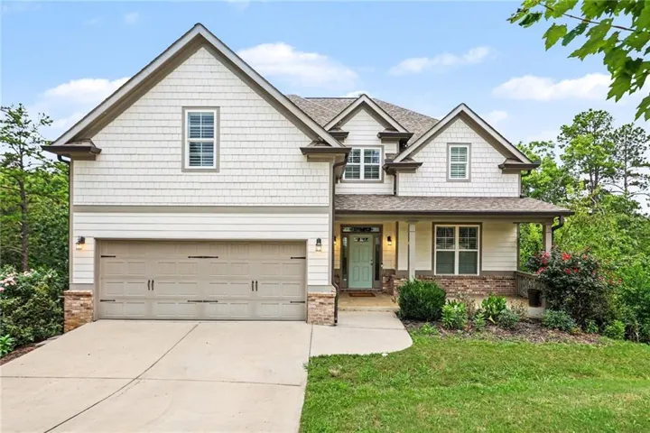 Craftsman-style exterior with stone veneer accents