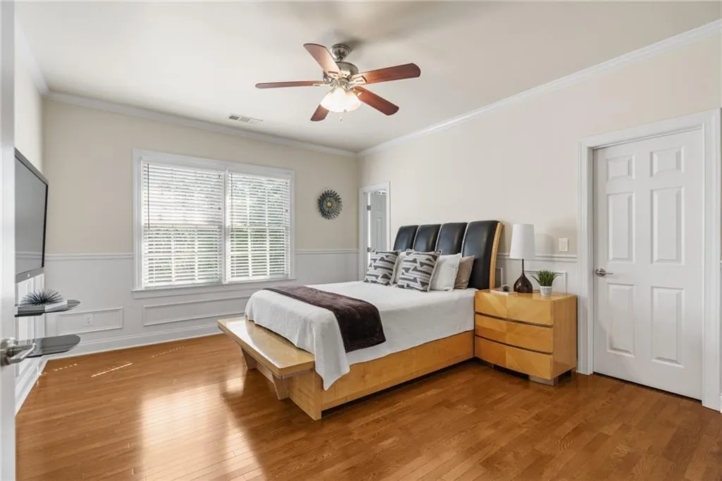 Secondary bedroom with hardwoods, private bath and large walk in closet.