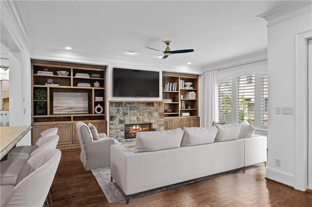 Open Great Room with fireplace and built-in bookcases