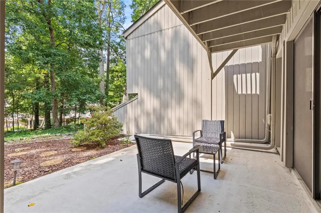 This private main level patio has a wooded backdrop and is very private with space for the pet to run around.
