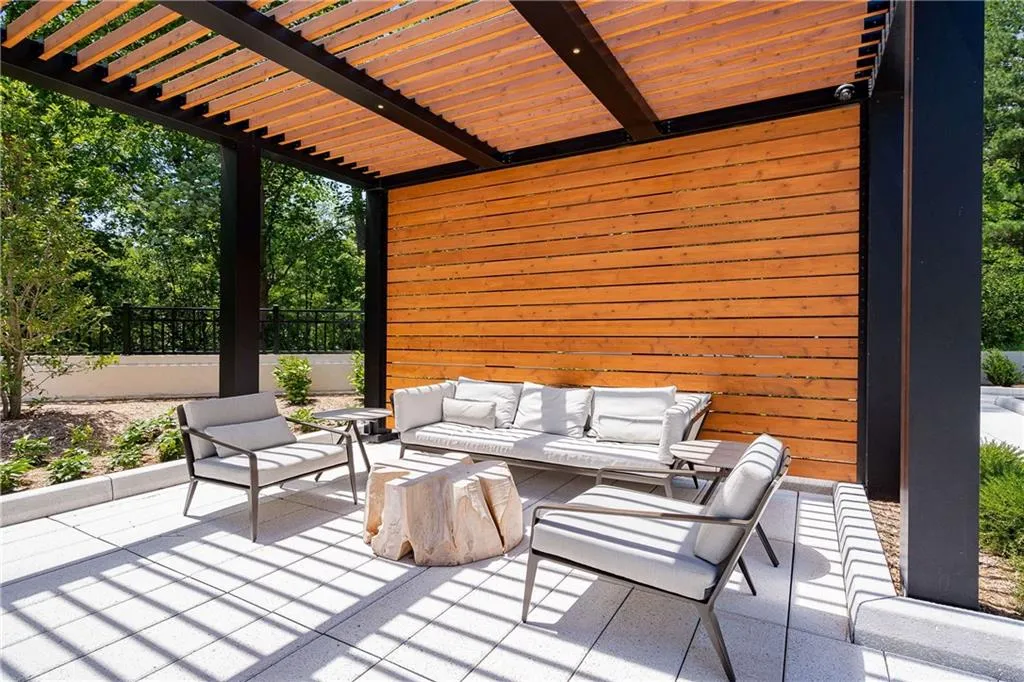 View of patio featuring an outdoor lounge area and a pergola