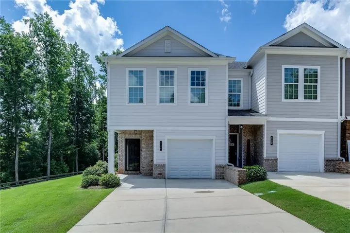 End-unit townhome with attractive curb appeal and a one-car garage.