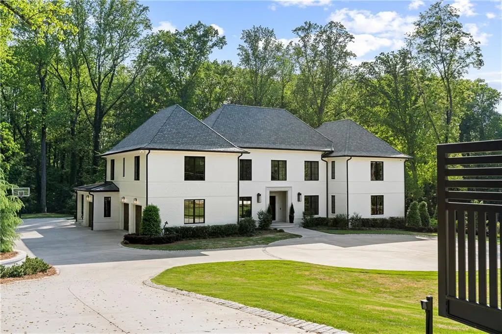 This timeless custom built gated estate is situated on nearly 6 acres of beautiful tree-lined property minutes to Chastain Park, Buckhead, Sandy Springs and esteemed private and public schools.