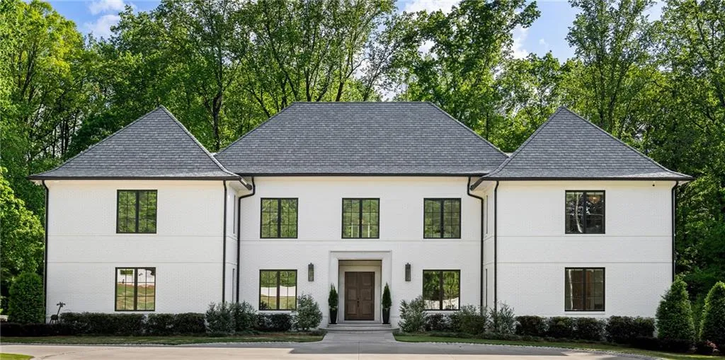This timeless custom built gated estate is situated on nearly 6 acres of beautiful tree-lined property minutes to Chastain Park, Buckhead, Sandy Springs and esteemed private and public schools.