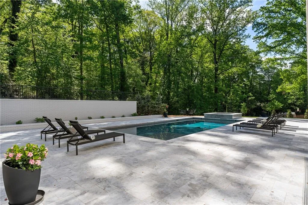 Gorgeous limestone decking around resort-style pool and courtyard