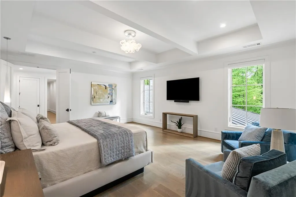 Beautiful trey ceiling and custom lighting in primary bedroom