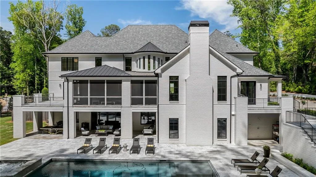 Resort style living with extra large and deep salt water heated pool and spa, covered patio with kitchenette and lounge area and firepit.