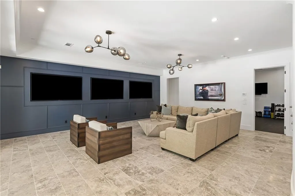 Three tv's provide an unbelievable theatre like experience, perfect for game day viewing. The sliding doors open fully to the outdoors blending the indoor and outdoor experience - perfect for the cool Fall and Spring weather!