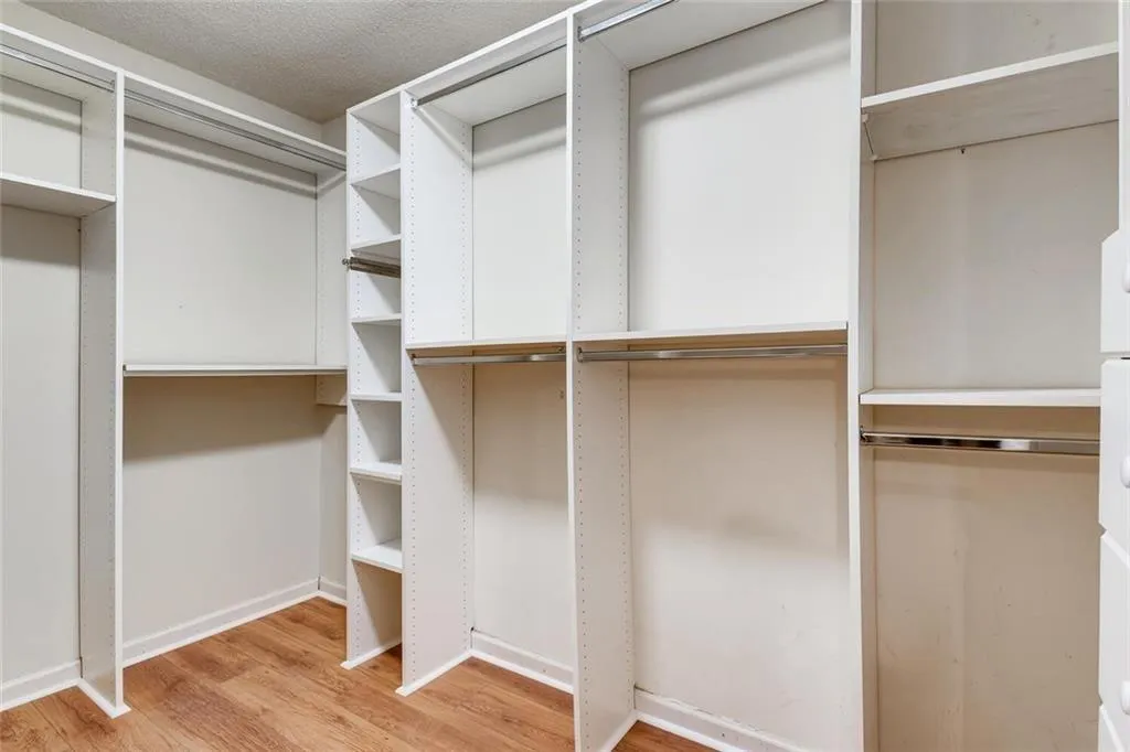 Walk in closet featuring light hardwood / wood-style floors
