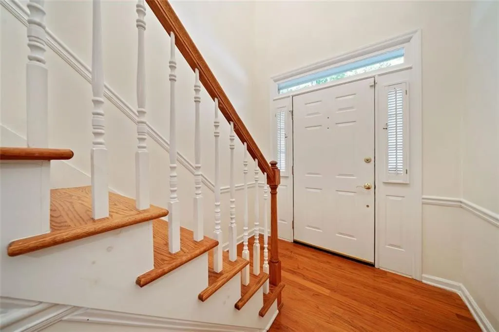 Foyer entrance with light hardwood / wood-style floors